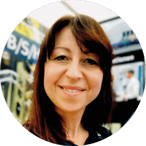 Porträtfoto einer lächelnden Frau als Kundenstimme für Lean-/Change-Begleitung